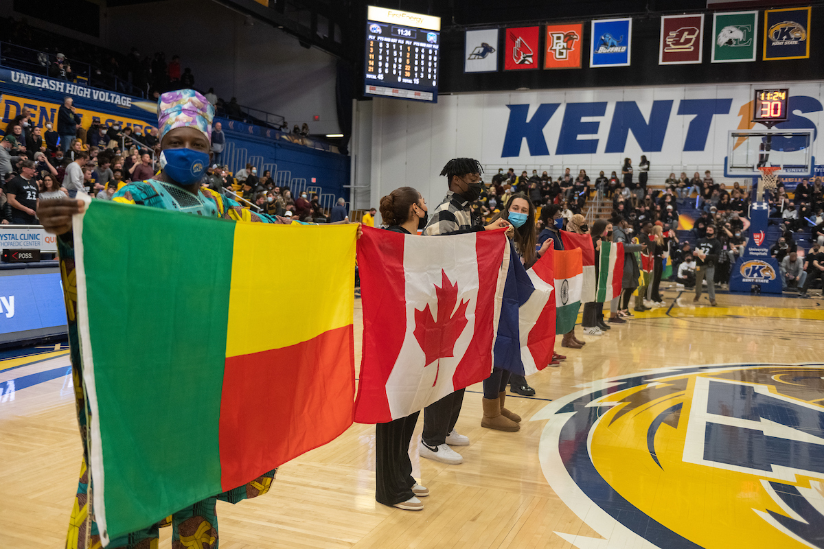International students with flags at a Ñý¼§Ö±²¥ State basketball game. International students with flags at a Ñý¼§Ö±²¥ State basketball game.