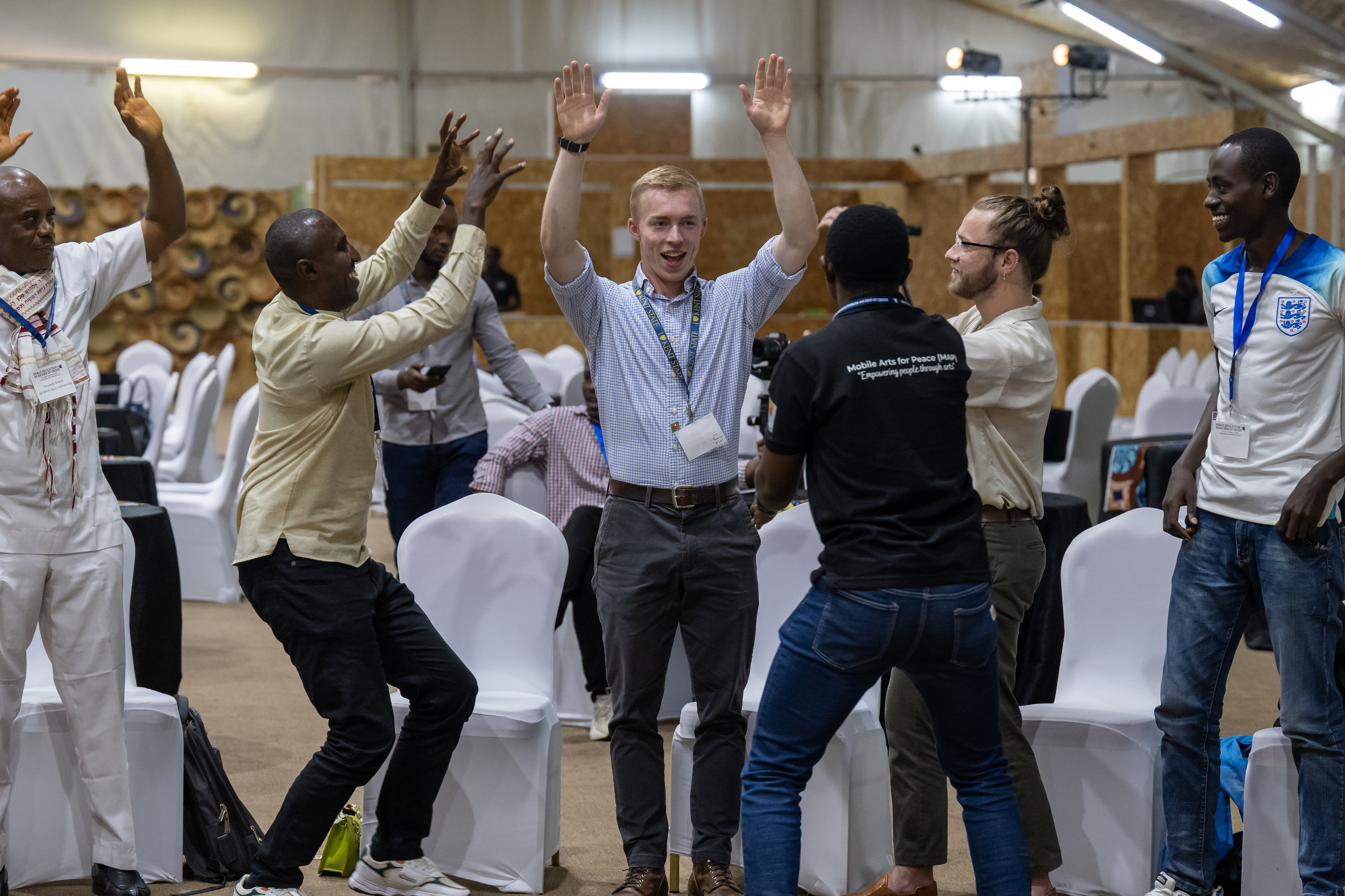 鶹ӰԺ State Student MIles Listerman takes part in an exercise during the global peace conference he attended in Kigali, Rwanda.