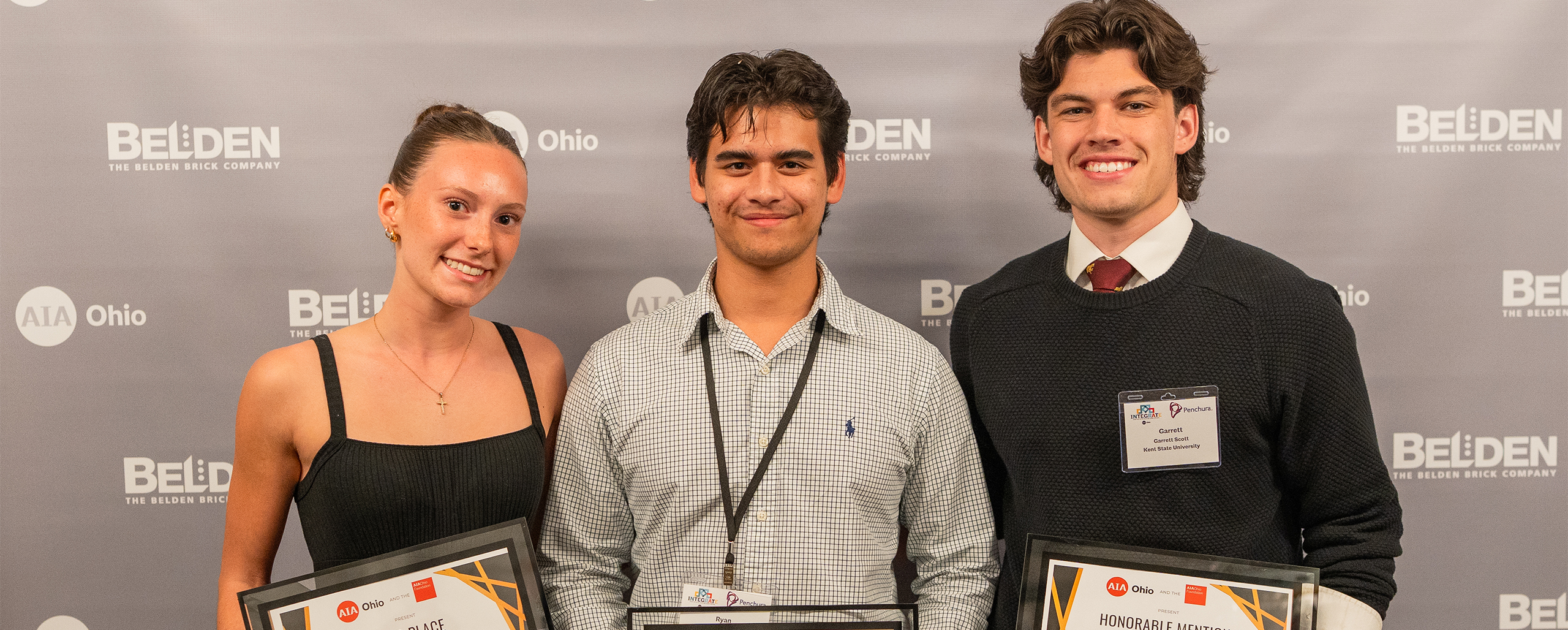 Three Architecture students holding AIA Ohio Awards at the ceremony