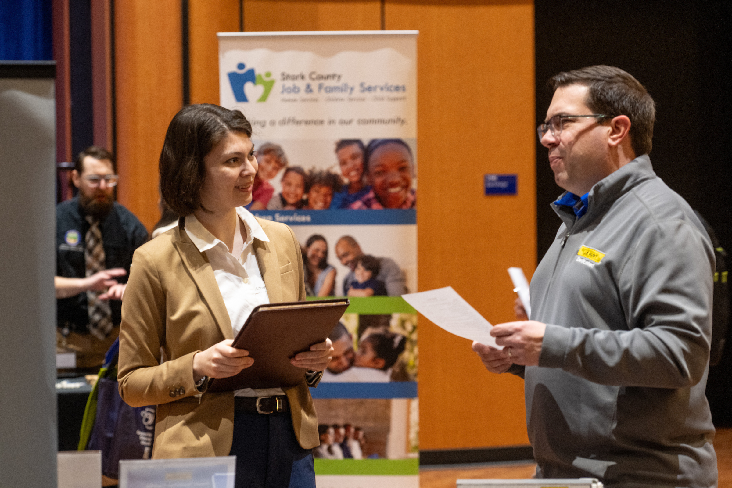 A Kent State student speaks with employers at the career fair