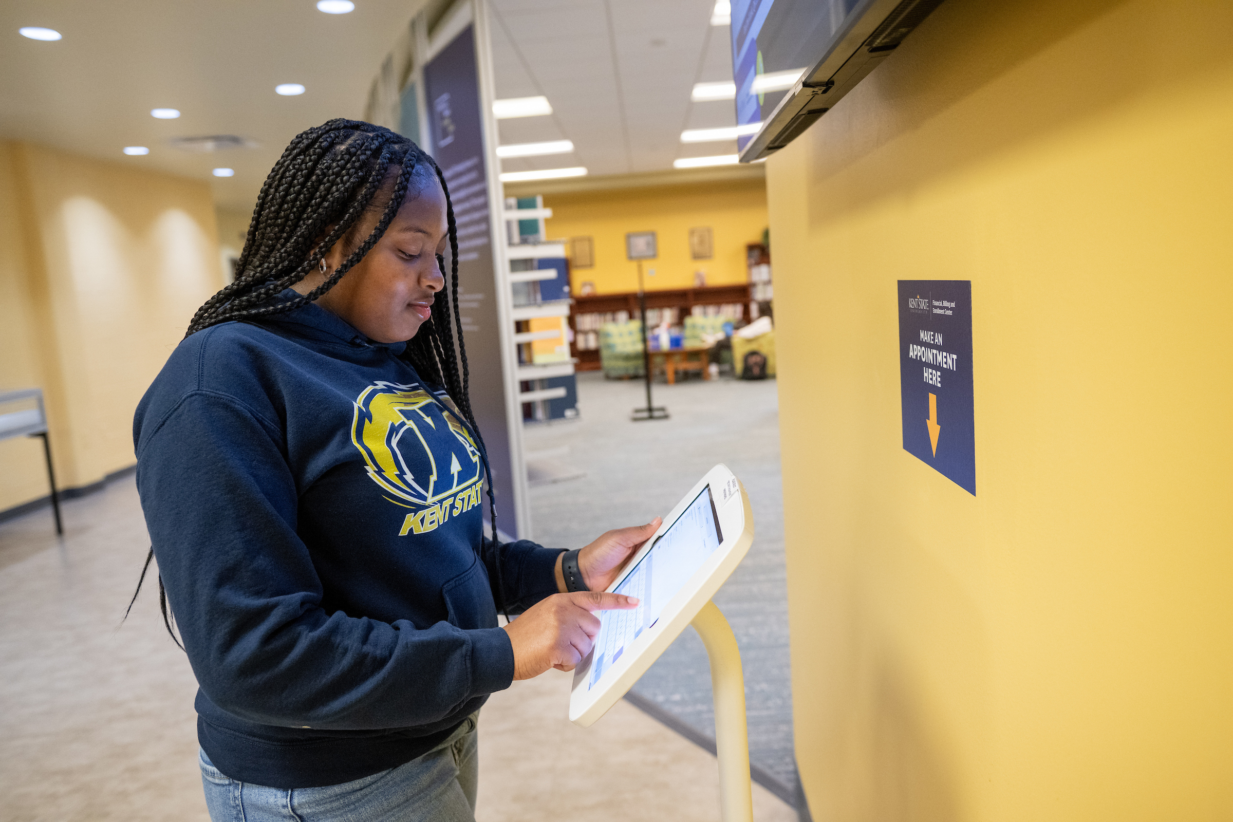 Student checks in at the Financial, Billing and Enrollment Center kiosk