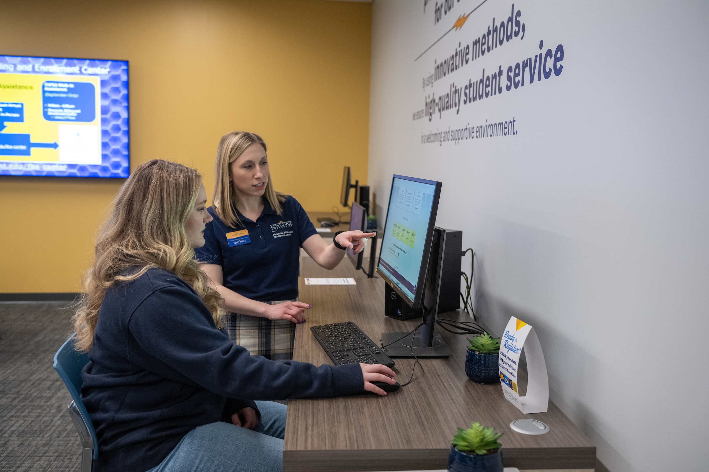 Student using a computer in the Financial, Billing and Enrollment Center