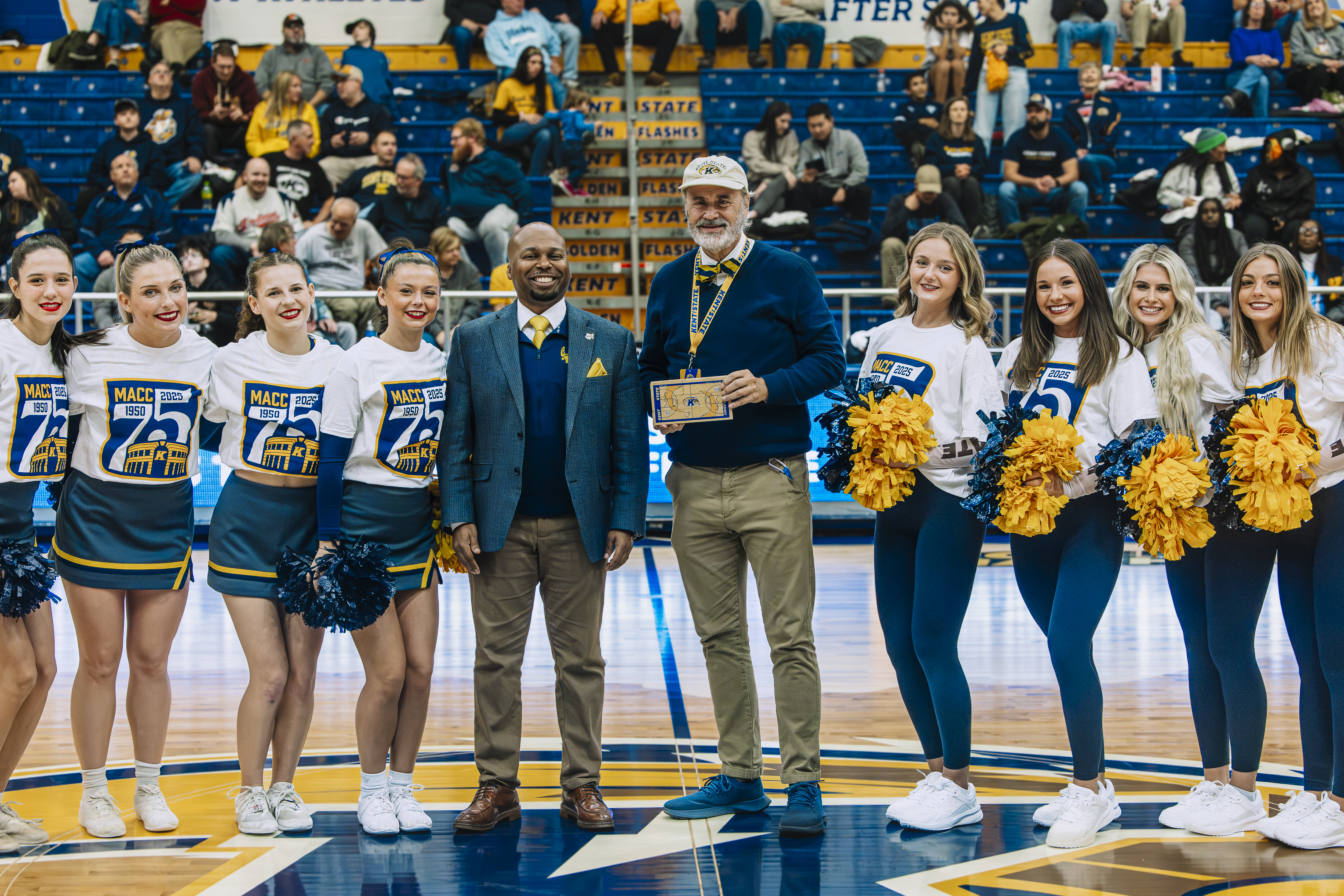 President Diacon accepts a piece of the MAC Center hardwood