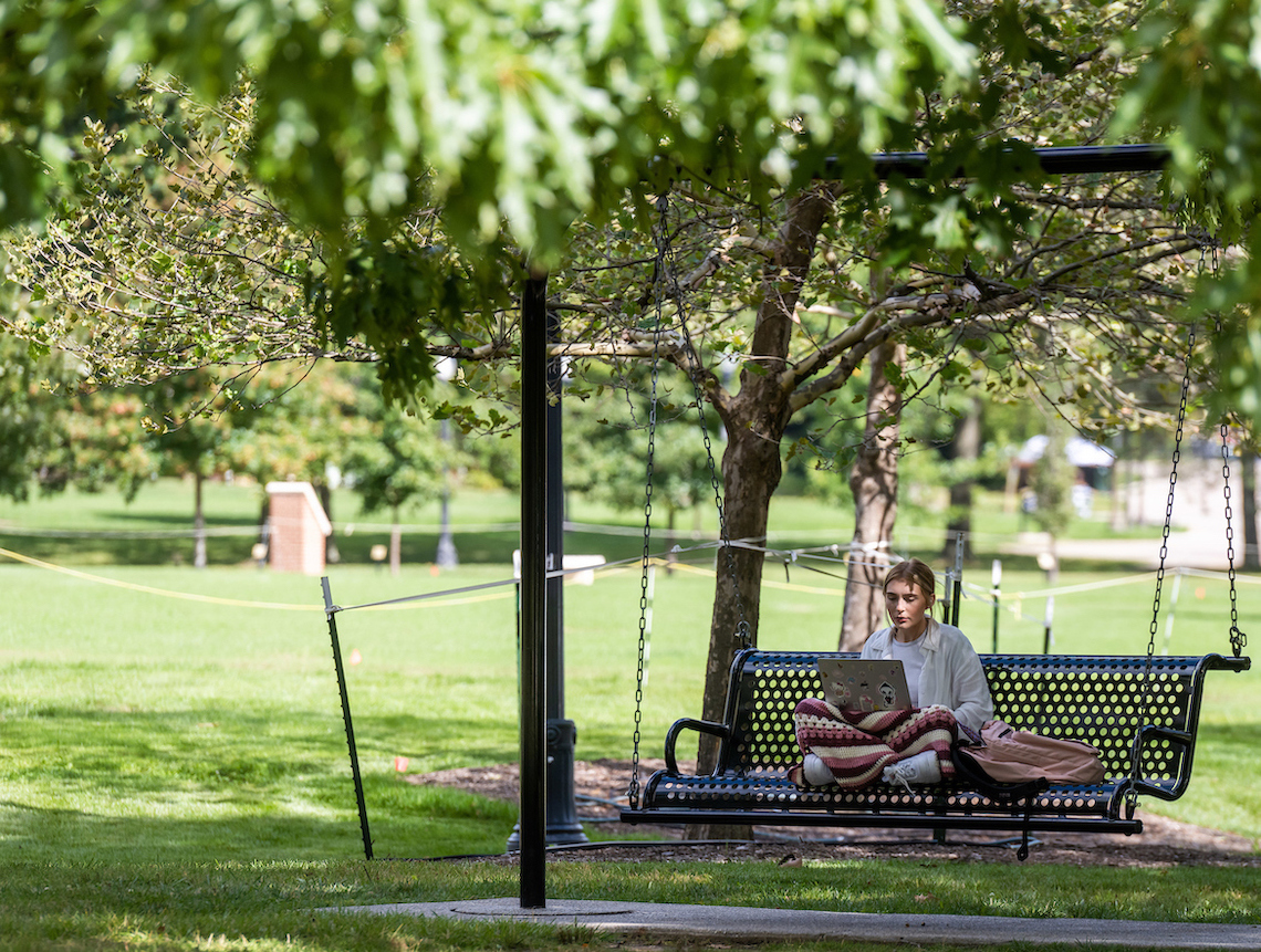 This student found a swinging place to study. 