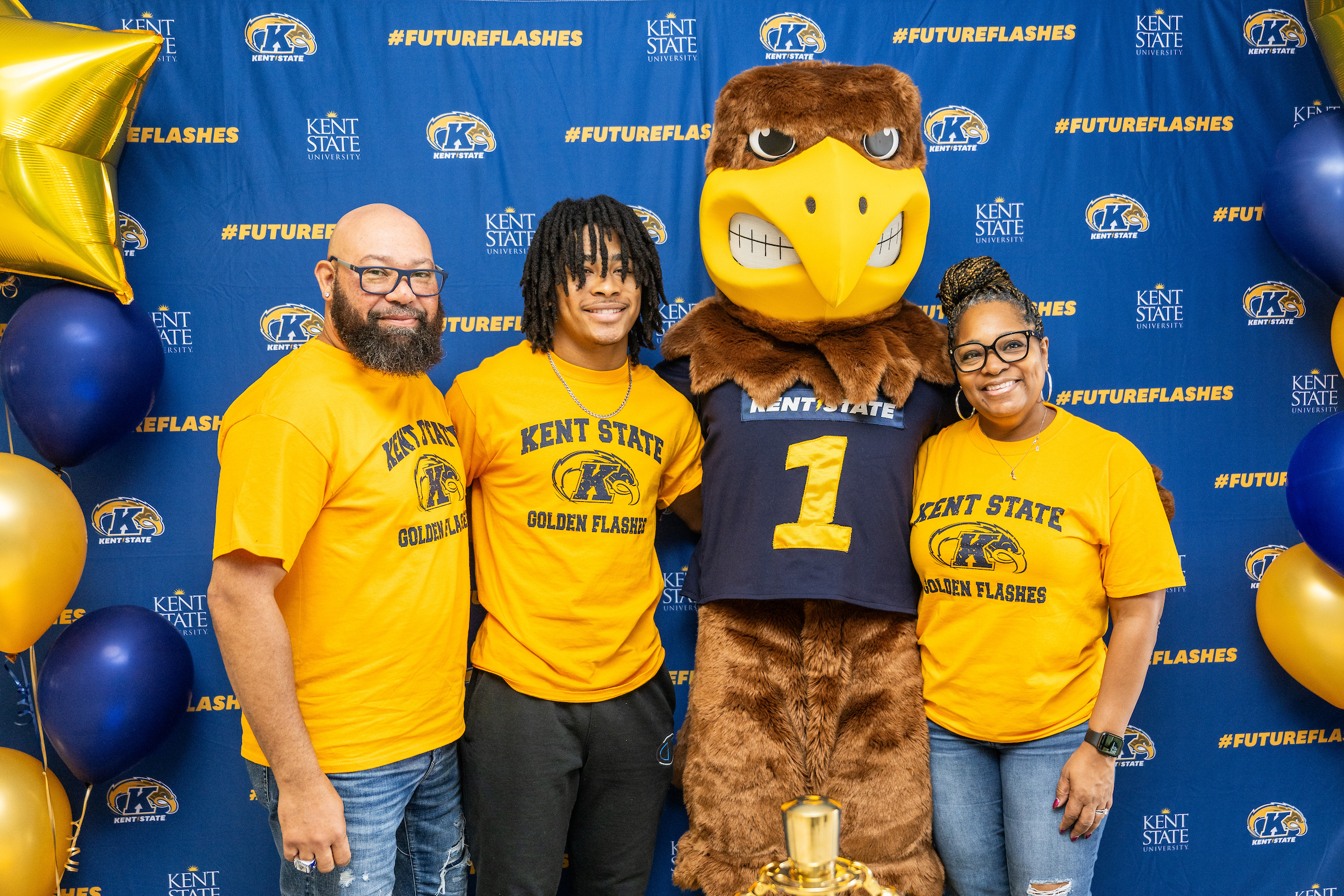 Student and family take a picture with Flash at Future Flash Day