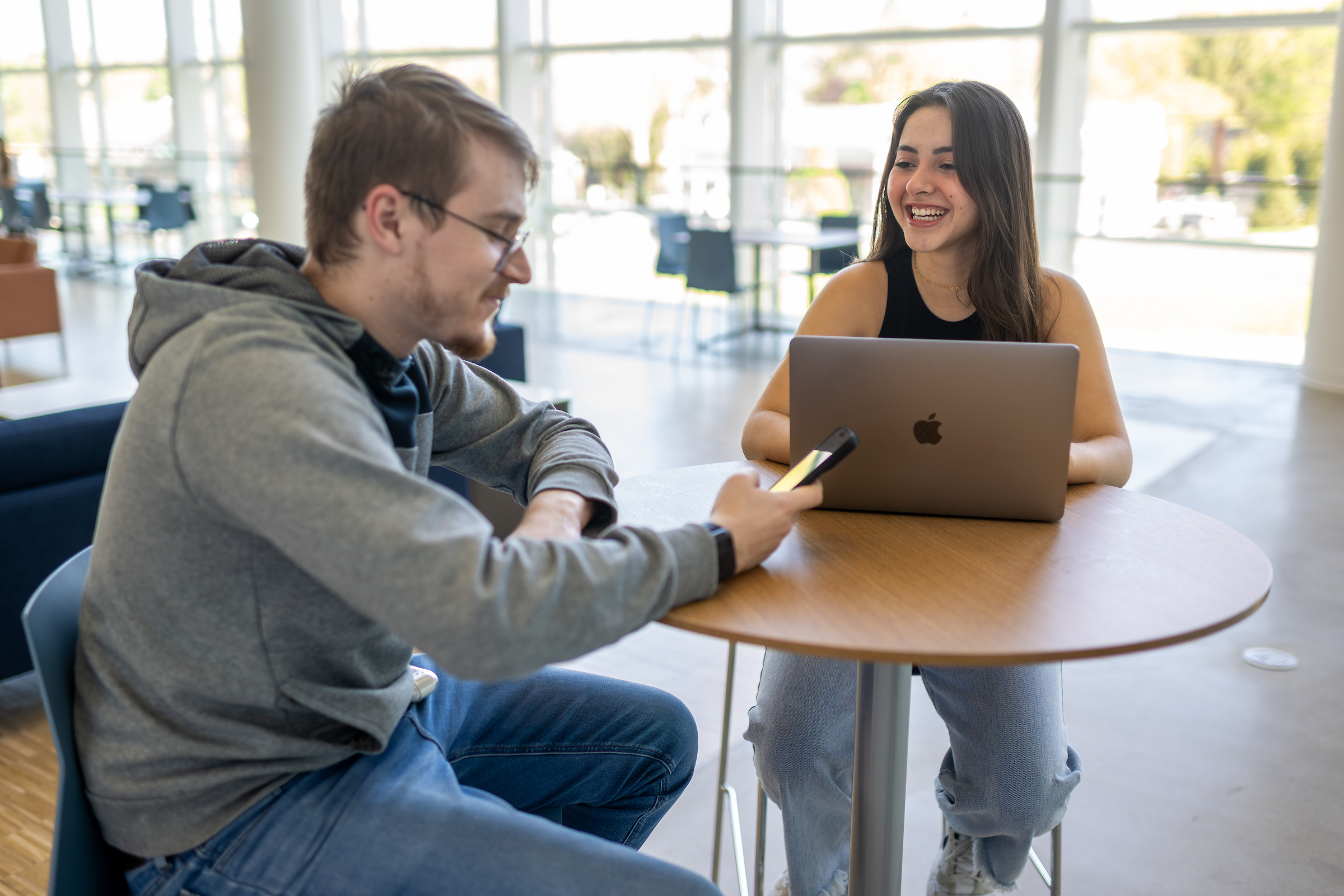 Two students sit together