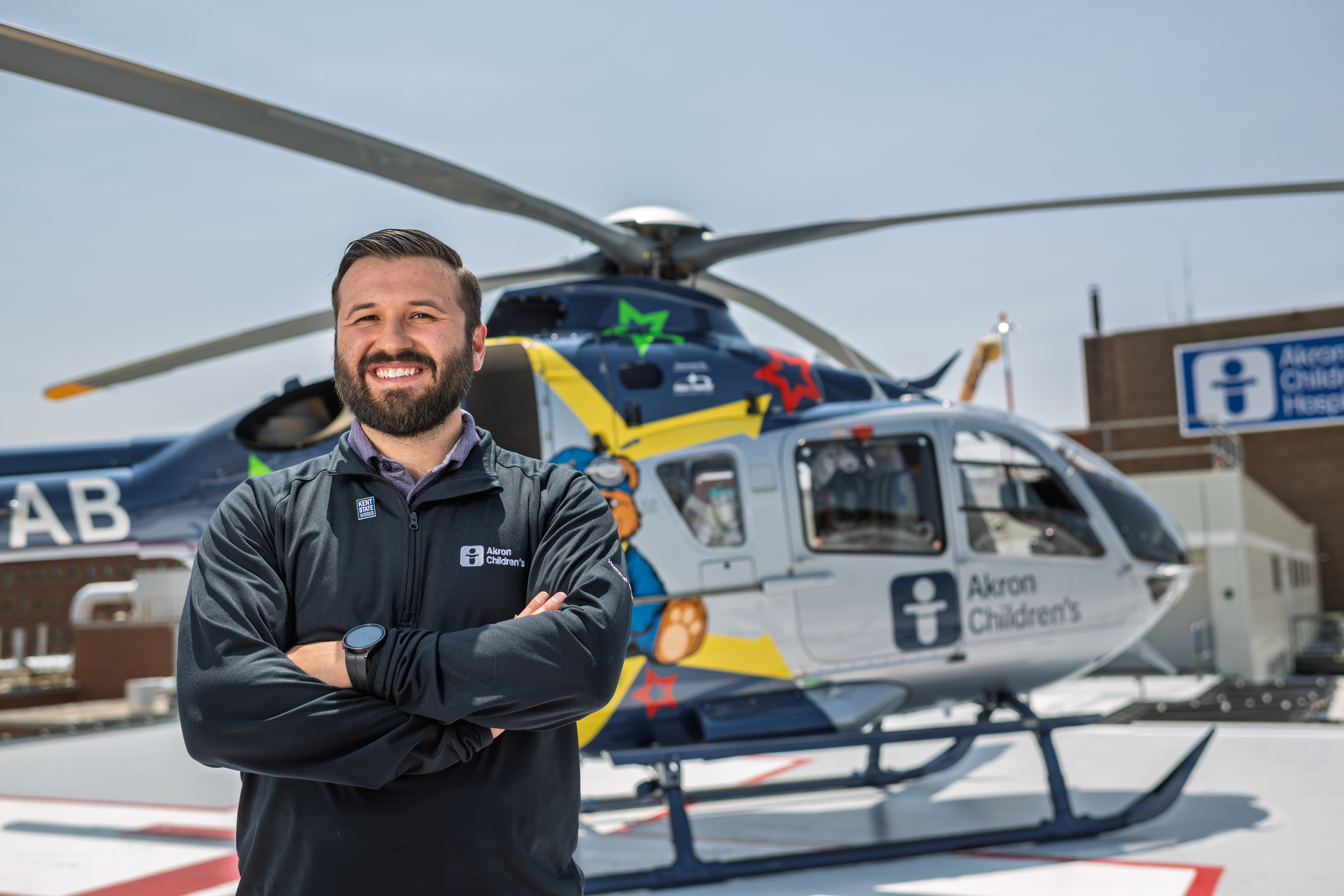 Teddy Pavlantos in front of helicopter