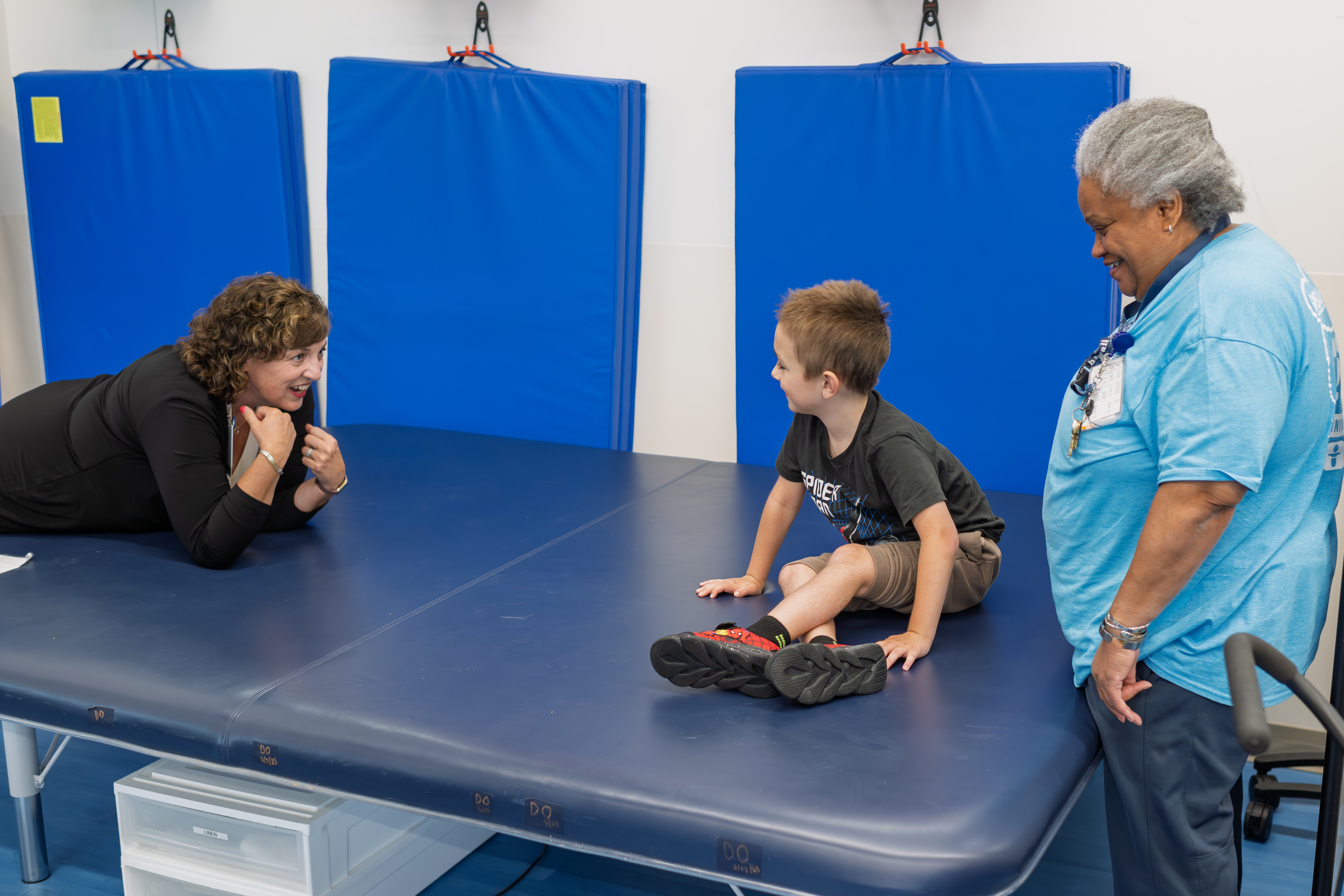 Lisa Aurilio playing with a kid at the hospital