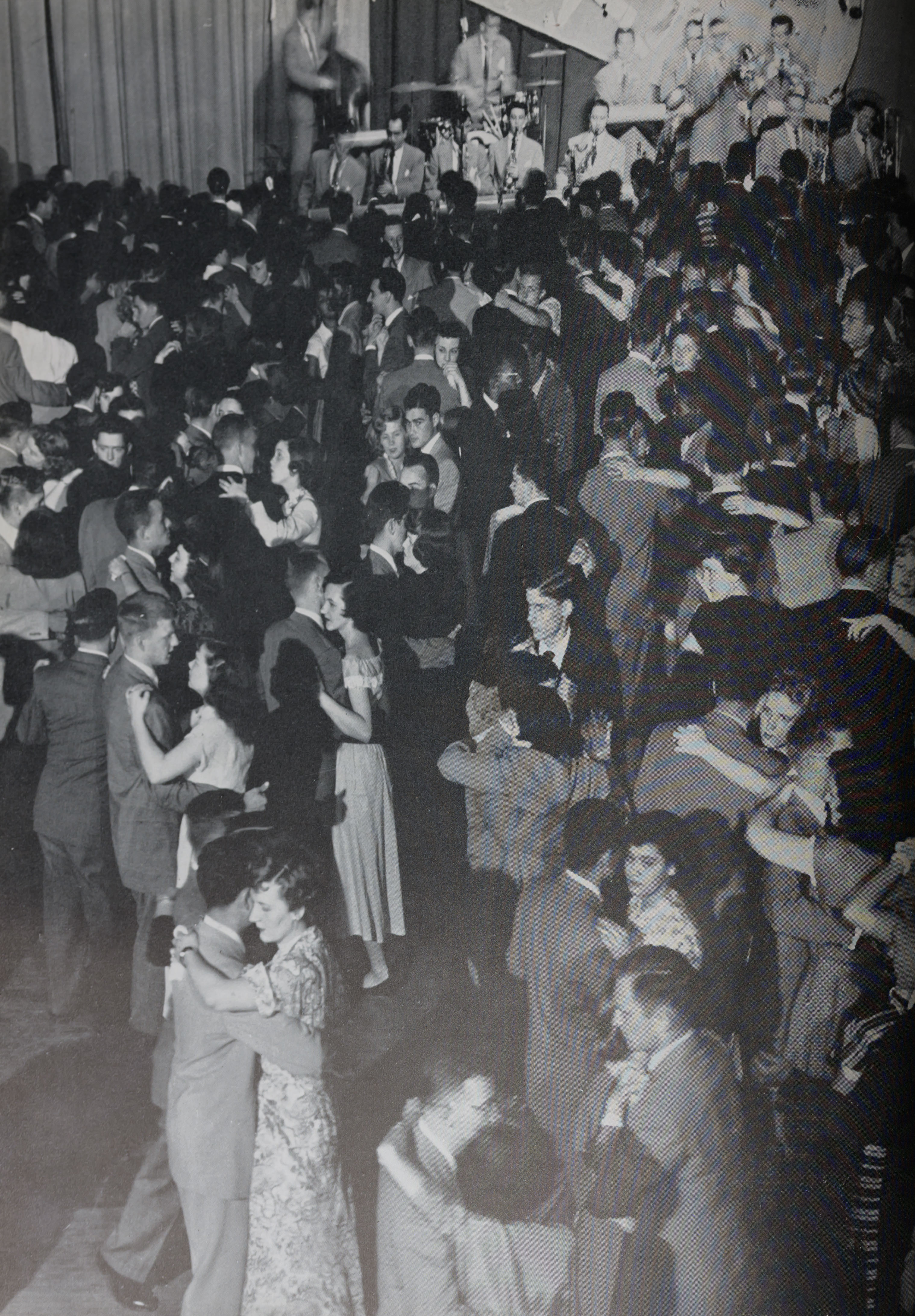 Students dancing at a dance with a band playing in 1951