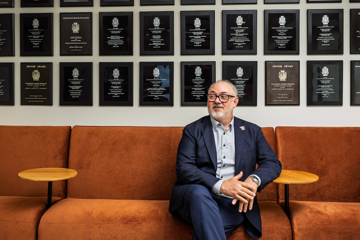 Matt Janiak sits in the DLR office by the firm's awards