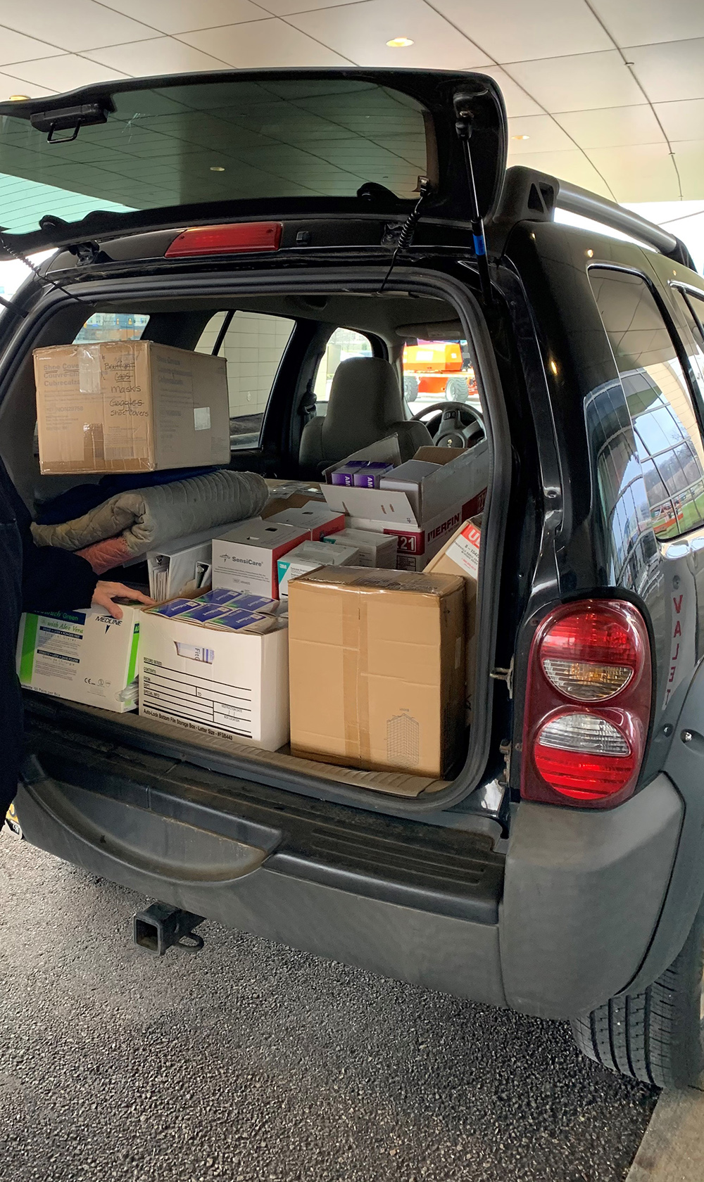 Nursing supplies in boxes in back of car
