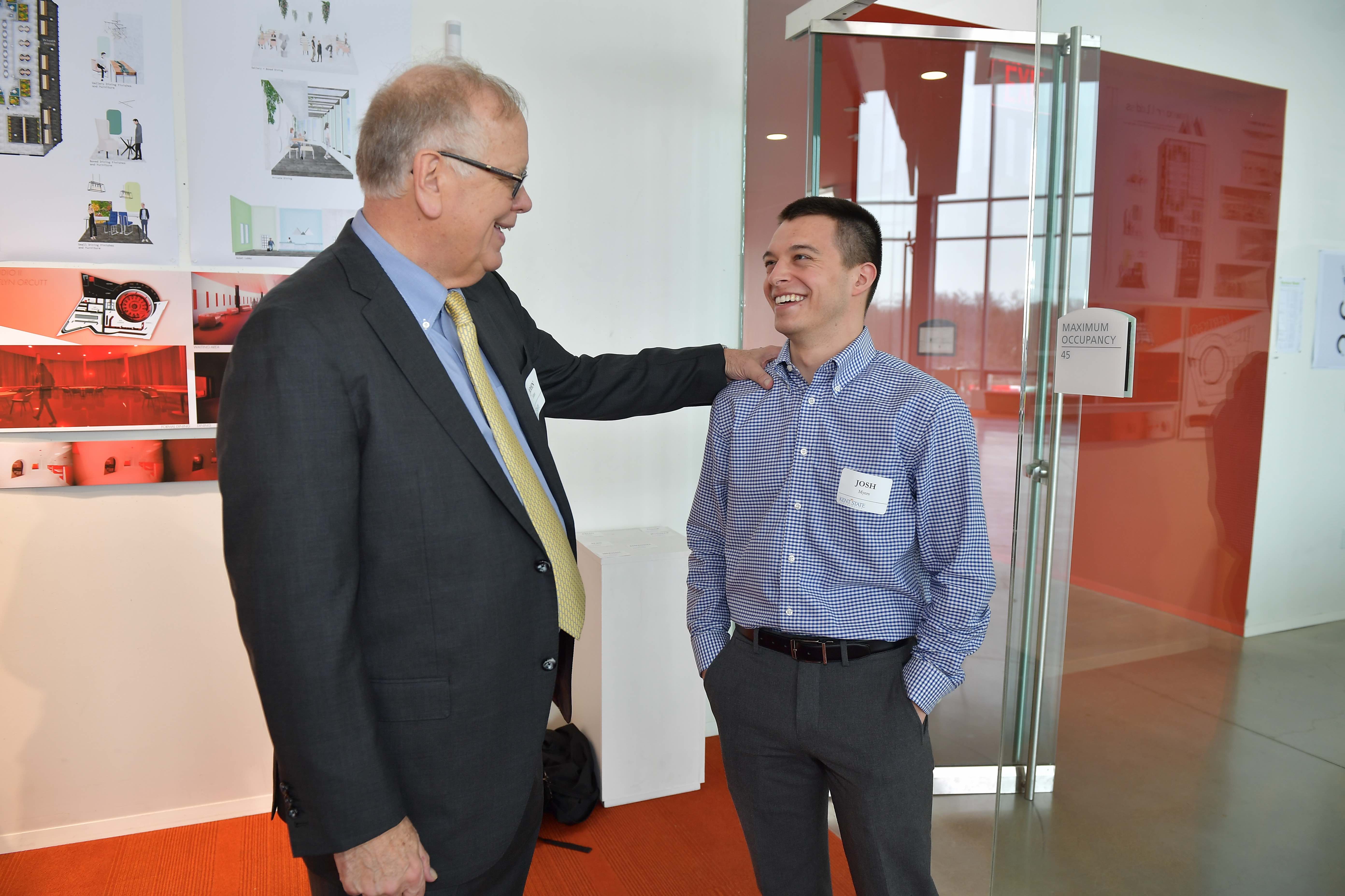 John Elliot talking with a student