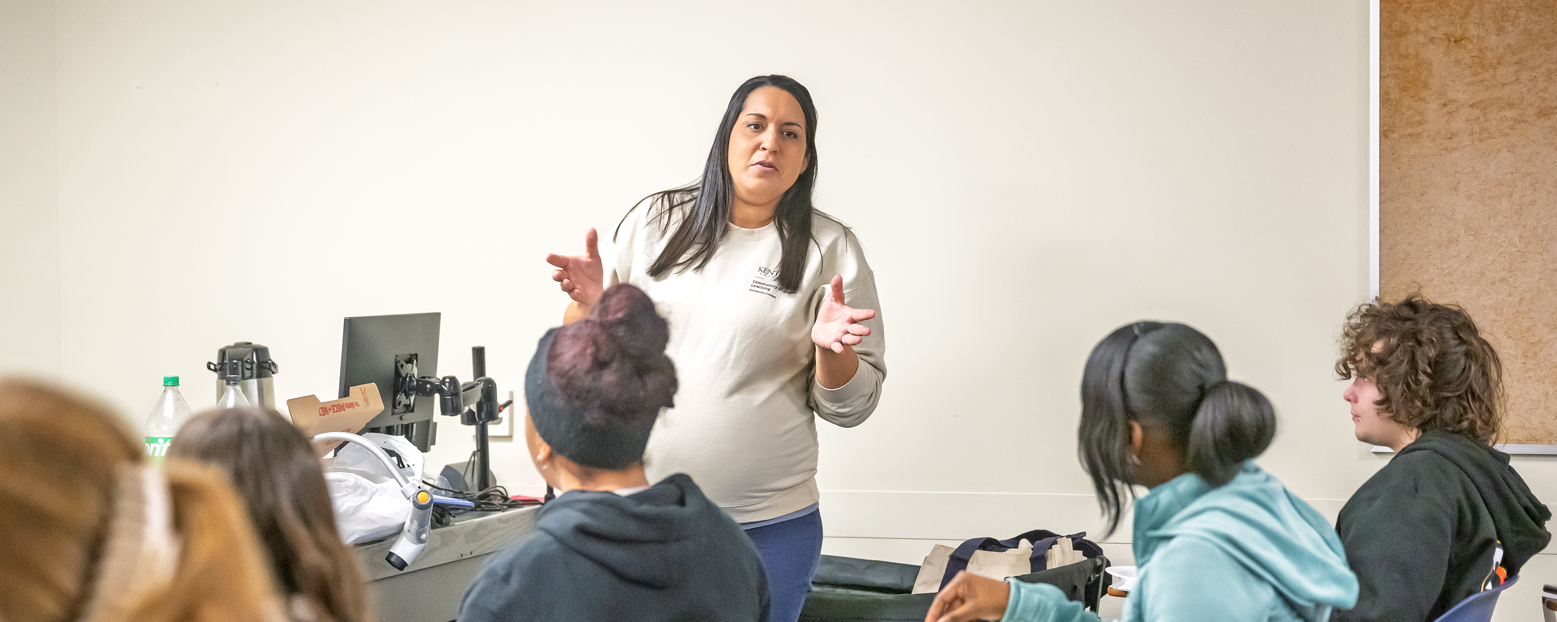 Brianna Benson talks to students.