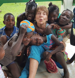 Brook Borgeson Gray with a group of Hatian Children