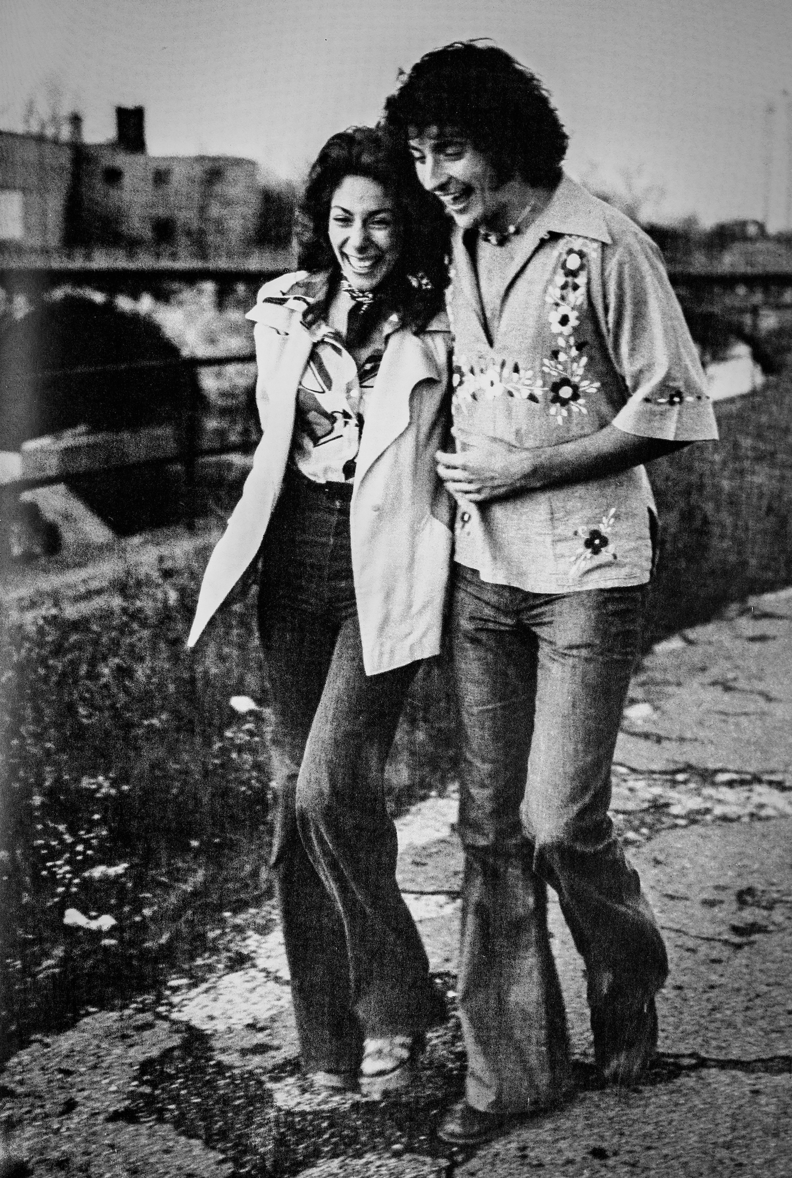 Two people walking on campus in 1976