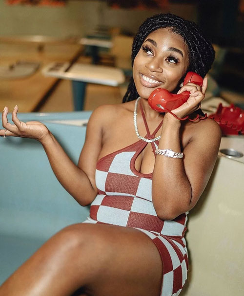 Promotional photo of Chelsea Pastel using a red phone