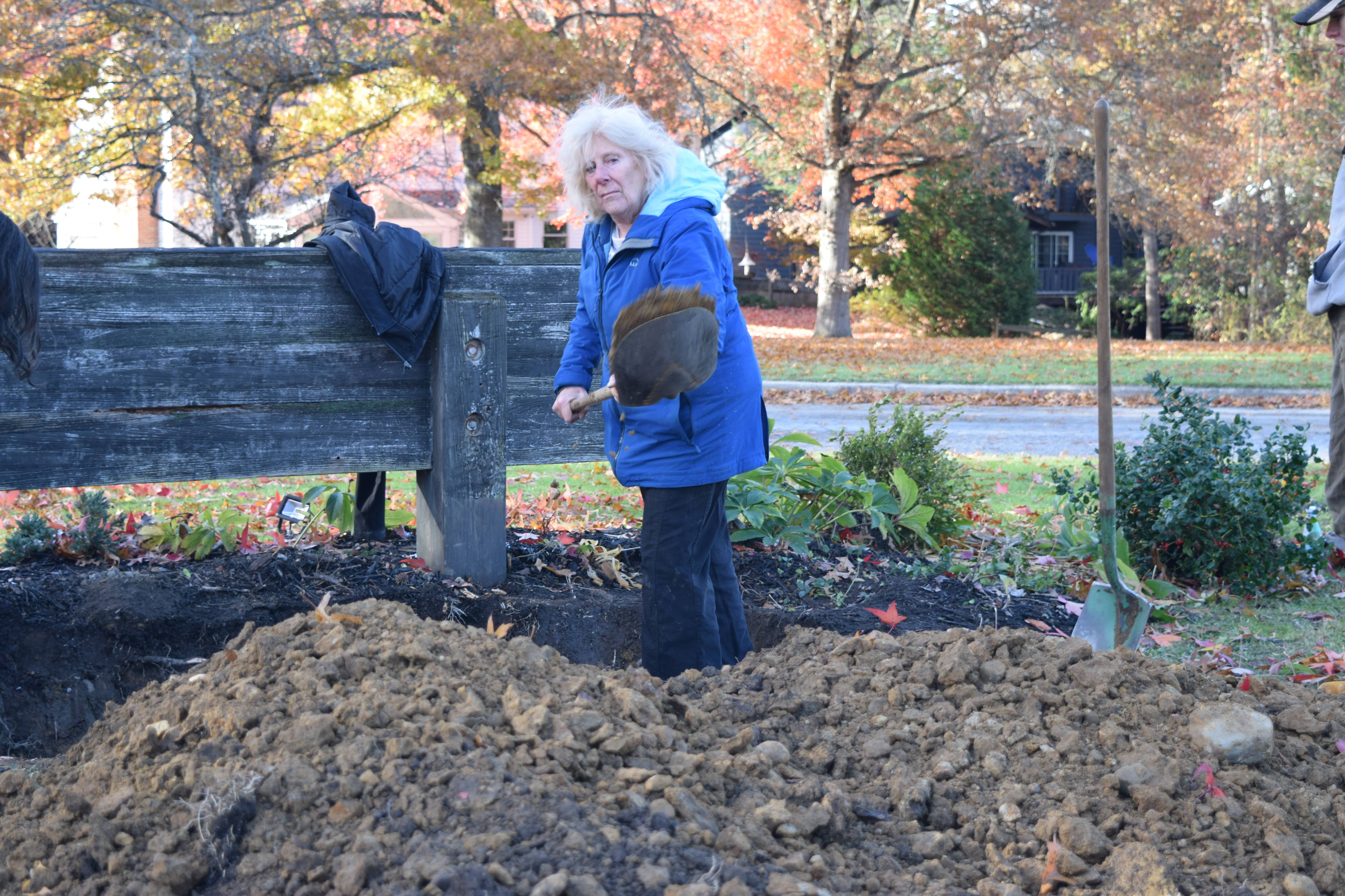 Linda Spurlock shovels dirt at the site