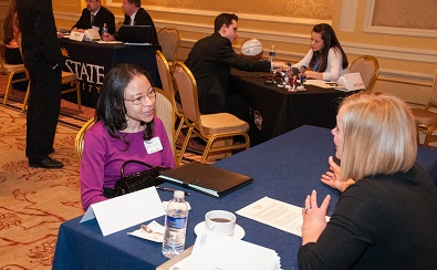 Student talks to recruiter at CCI JobExpo.