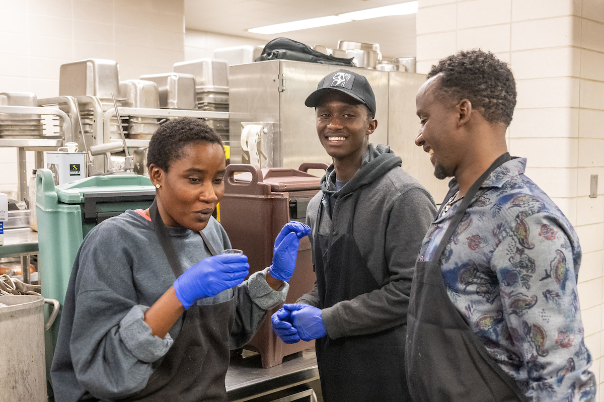 Team Rwanda members sample their ginger team before the competition.