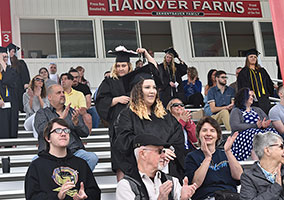 Families and graduates in the grandstands Families and graduates in the grandstands