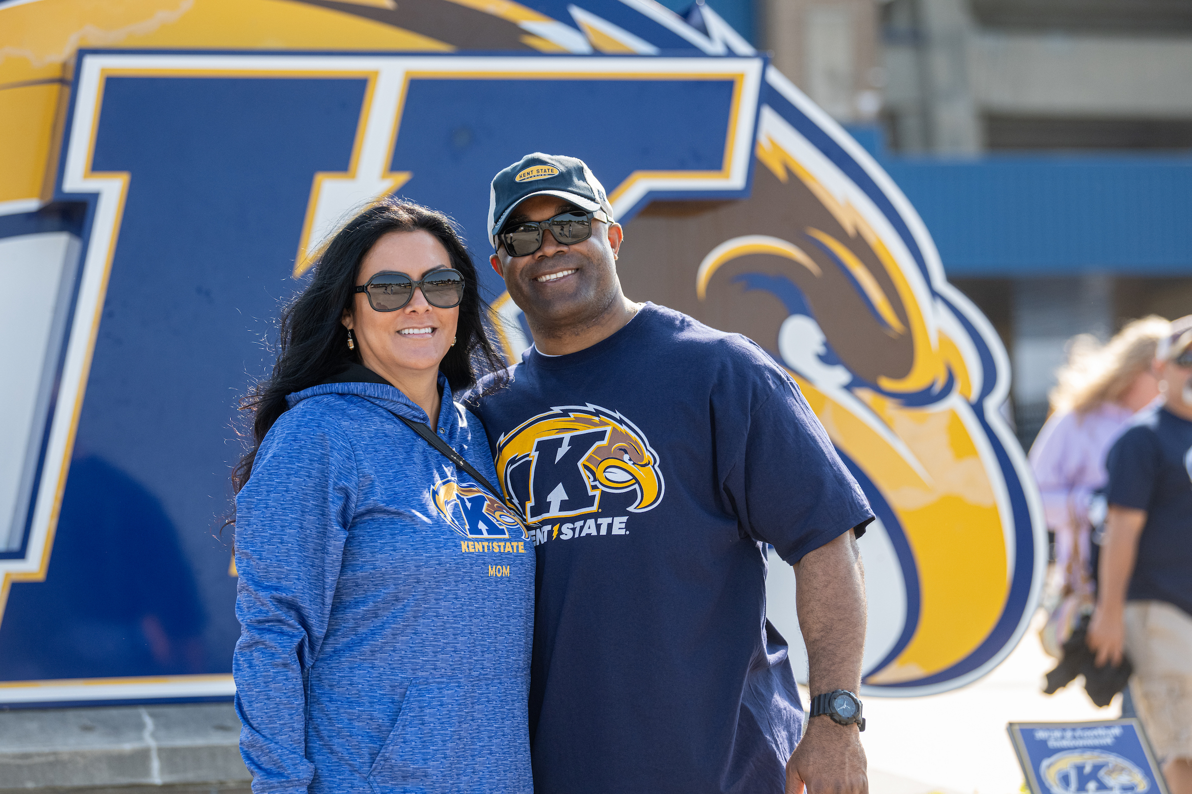 Former Kent State Students wearing kent state clothes