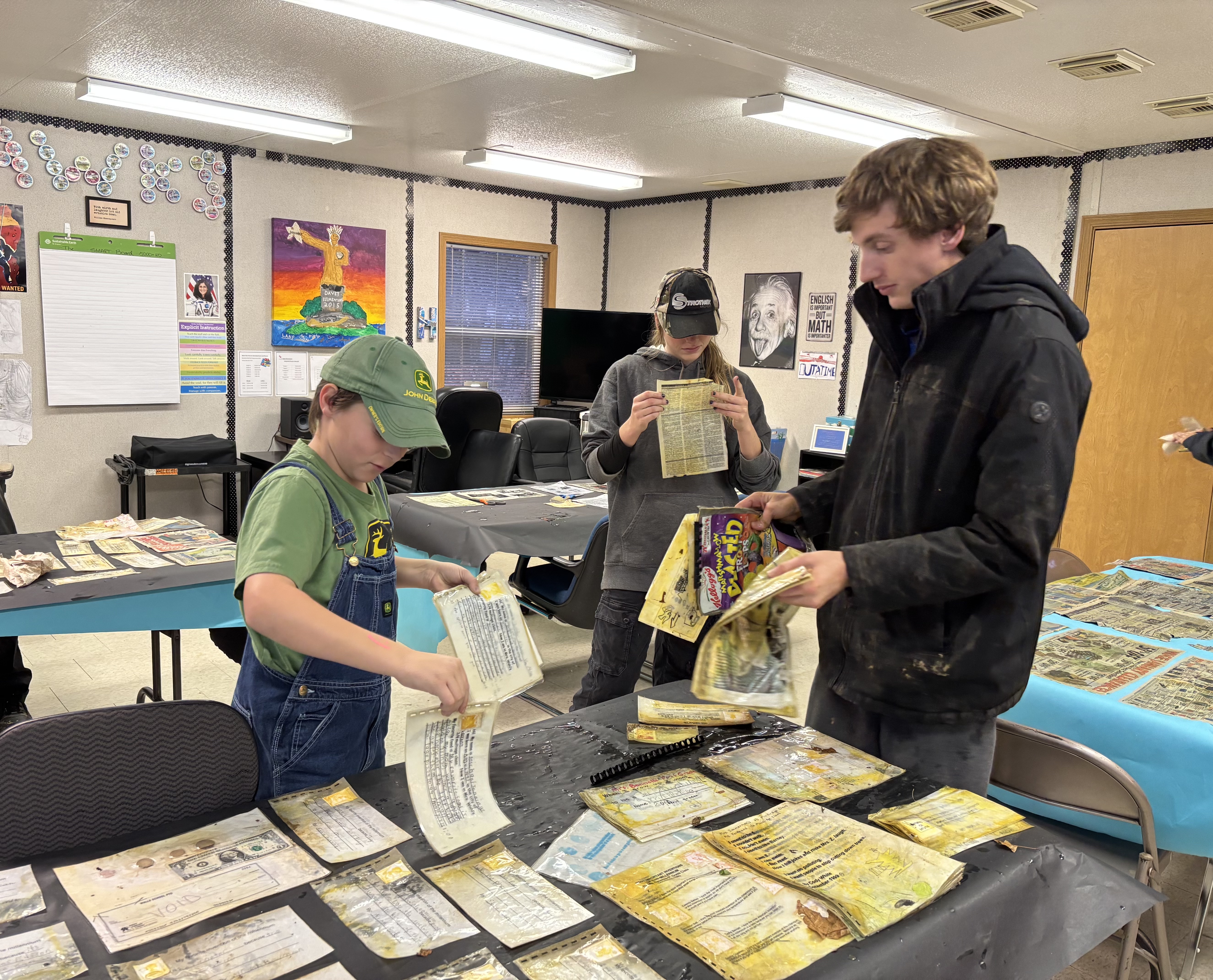 Kent State student discusses the artifacts with a Walls student