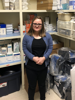 Erin Hawley takes inventory in the Skills Lab storage room