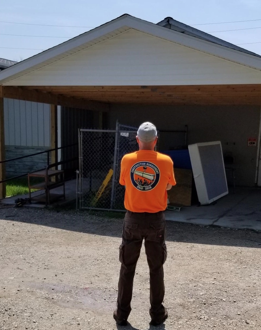 man looking at completed building