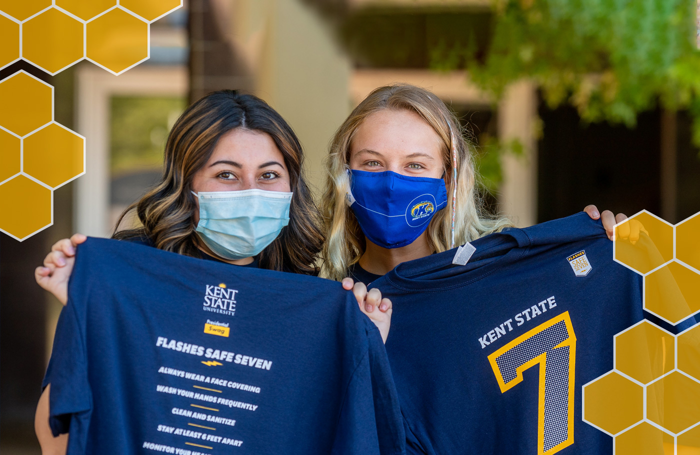 Kent State students holding t-shirts for Giving Tuesday