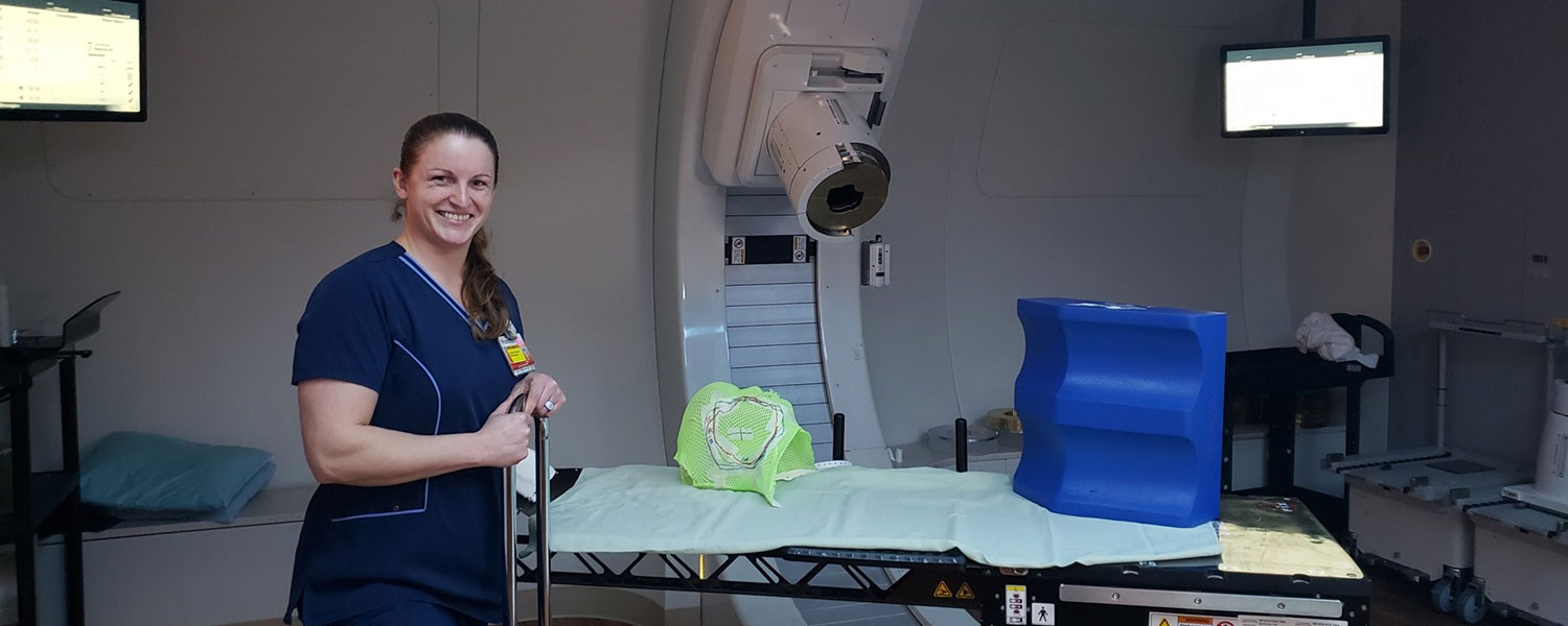Jill Cofojohn in a proton therapy treatment room.