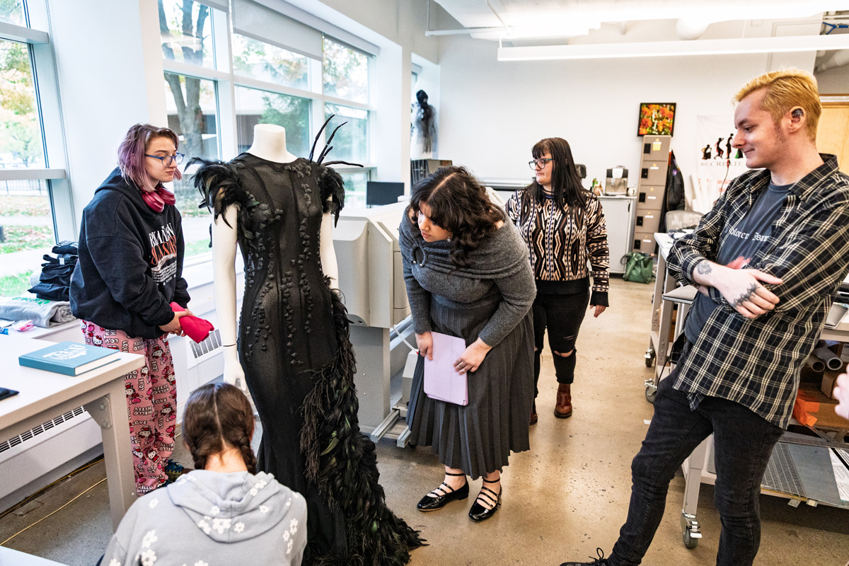 Fashion students studying exhibit at 51�Թ��� Fashion Museum