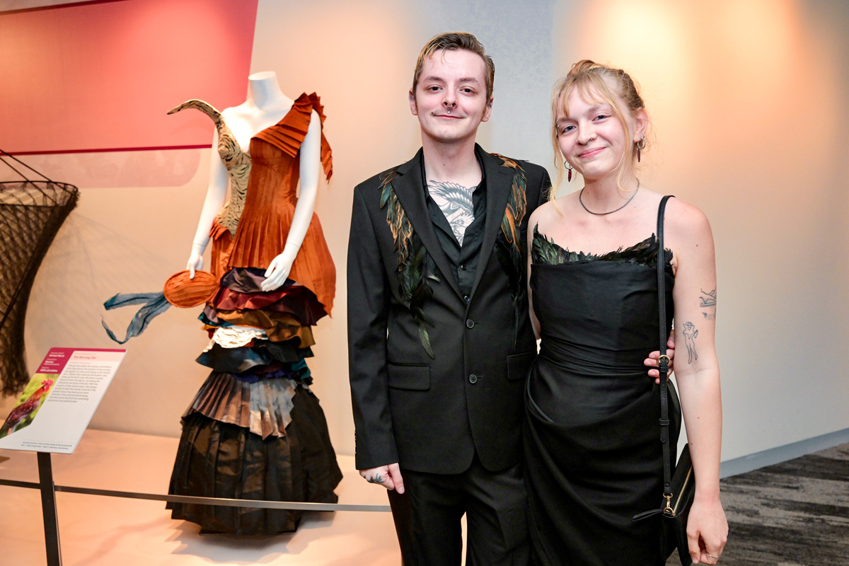 Designer in front of his gown at Museum of Natural History