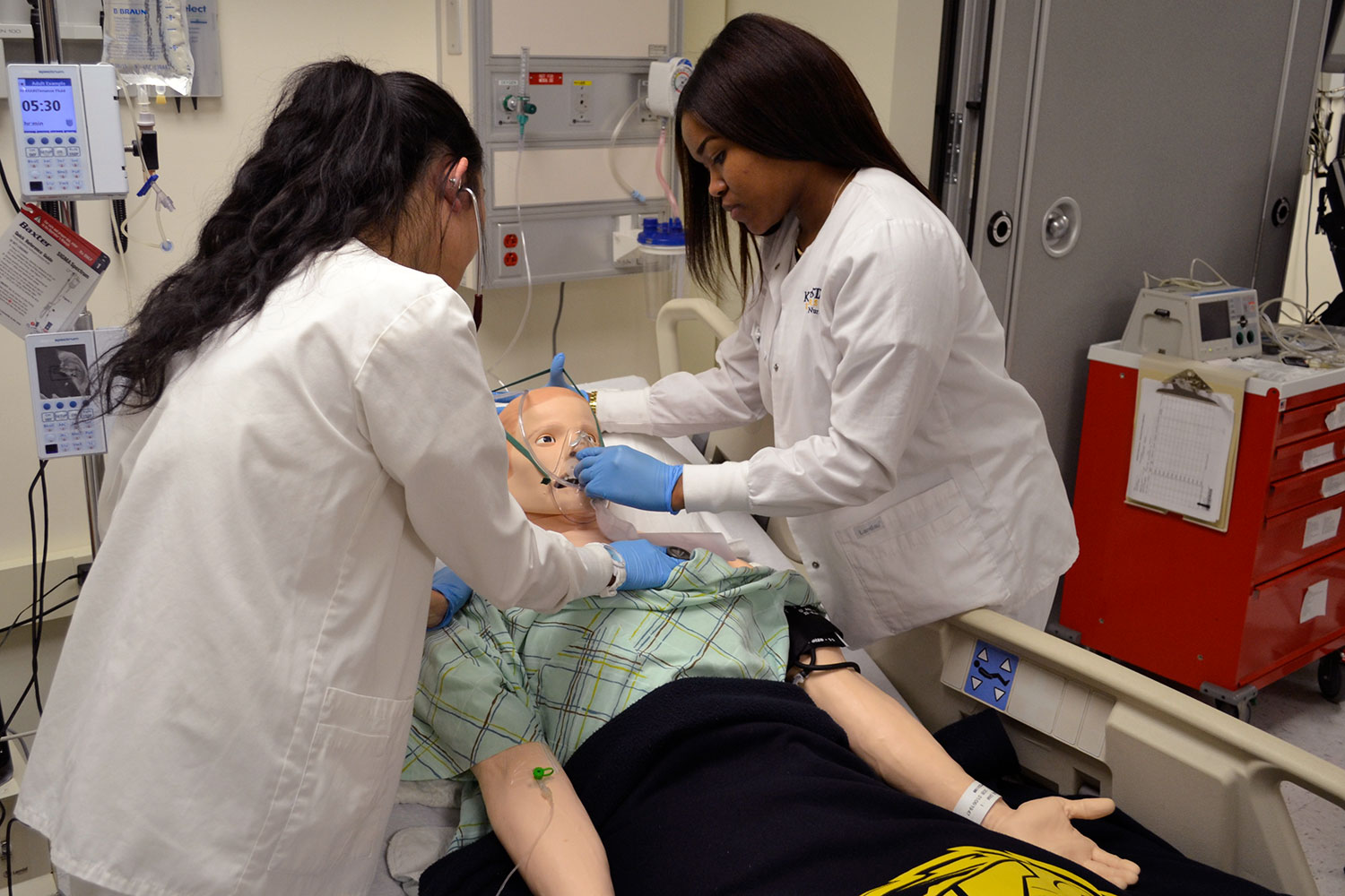 Kent State University nursing students receive hands-on learning experience by practicing on a simulator.