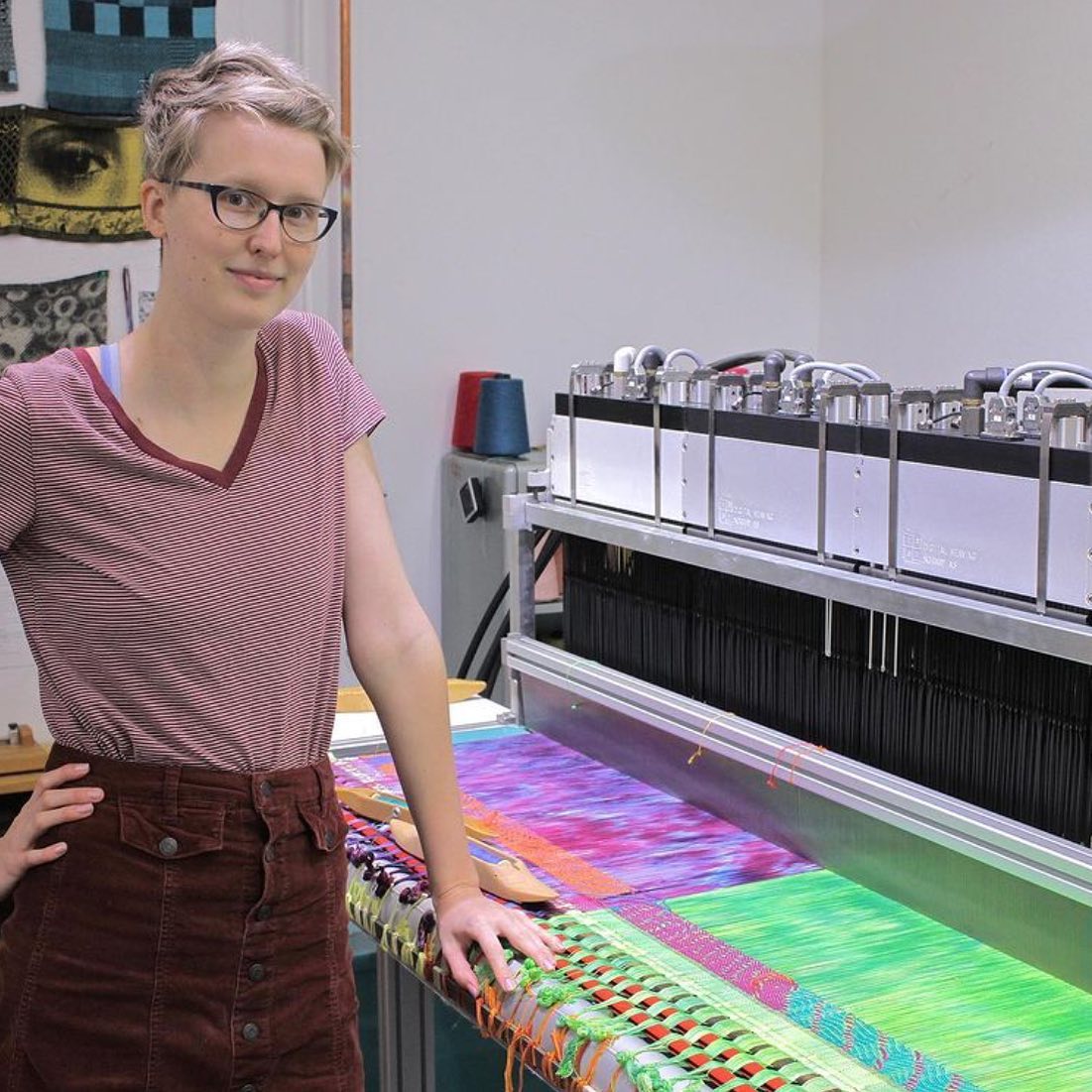 MFA student Meagan Smith working on a digital loom in the studio.