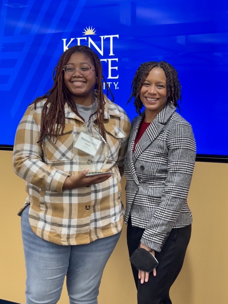 Siobhan Hicks receiving the Spirit of UC award from Dean Pringle.