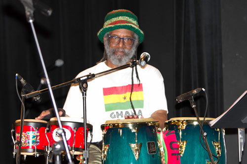 Photograph of a drummer at a set of drums