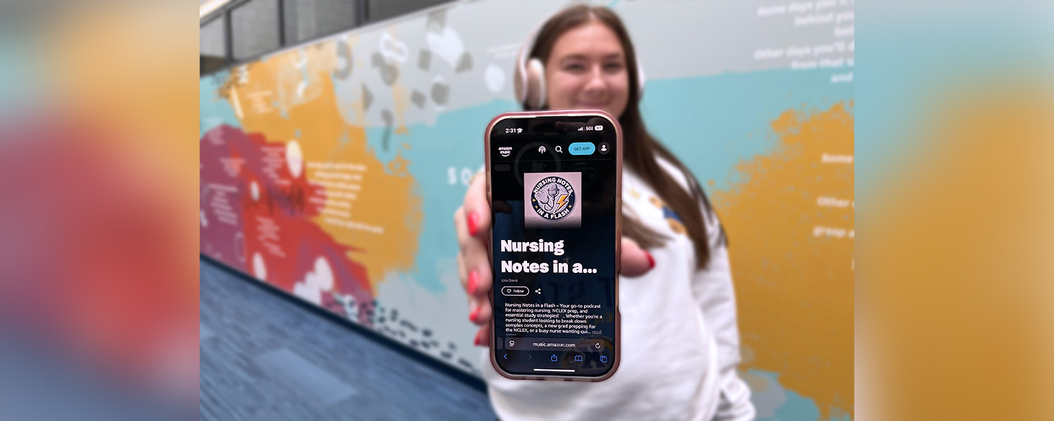 A nursing student wearing headphones holds their phone straight out in front of them with the Nursing Notes in a Flash Podcast displayed on the screen.