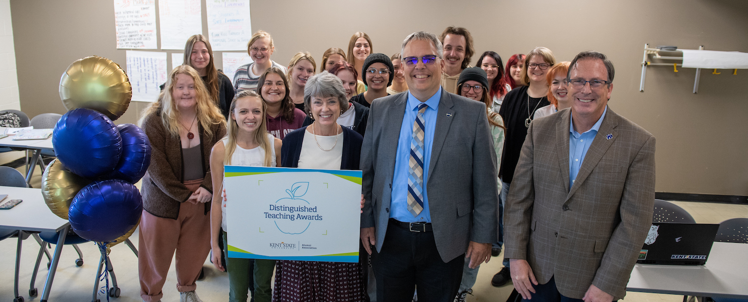 Dr. Osborn poses with students and awards committee