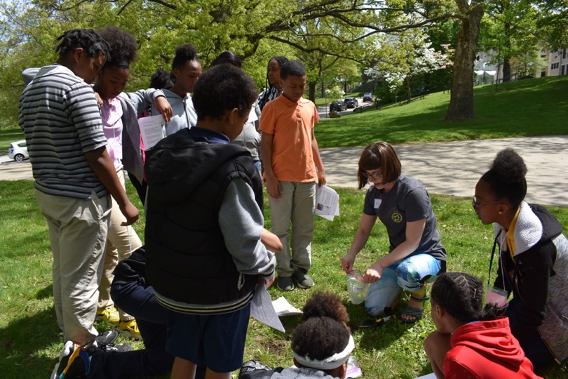 KSU Department of Geology graduate student Kortney Cole showing Schumacher Elementary School 6th grade students how to collect soil samples. KSU Department of Geology graduate student Kortney Cole showing Schumacher Elementary School 6th grade students how to collect soil samples.