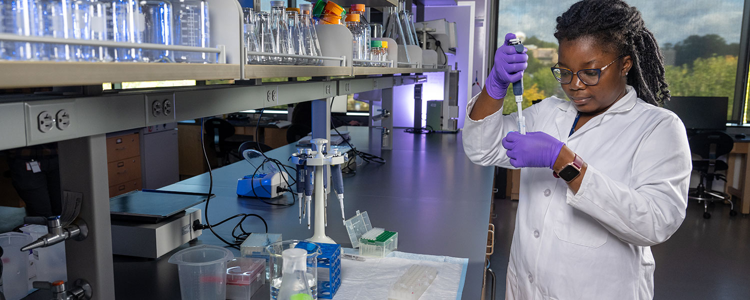 Kent State graduate student Thywill Ettey, a third-year doctoral student in the School of Biomedical Sciences, conducts laboratory research.