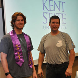 Travis Diem, graduating from Crestview High School, received his Rising Scholars stole from his father. Travis Diem, graduating from Crestview High School, received his Rising Scholars stole from his father.