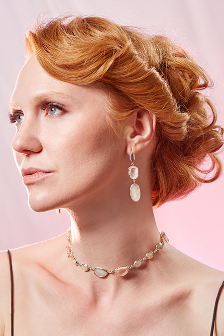 Photo of a model wearing earrings and a necklace made by Michelle Pajak-Reynolds