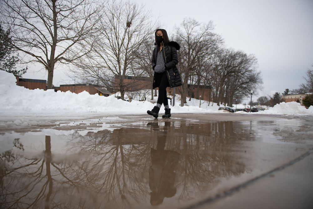 Student walking in the winter