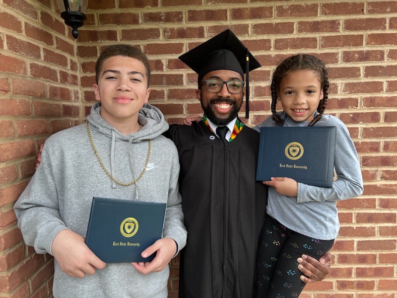 After 15 years, Canton resident Timothy Johnson earned his associate and bachelor's degrees from Kent State. After 15 years, Canton resident Timothy Johnson earned his associate and bachelor's degrees from Kent State.