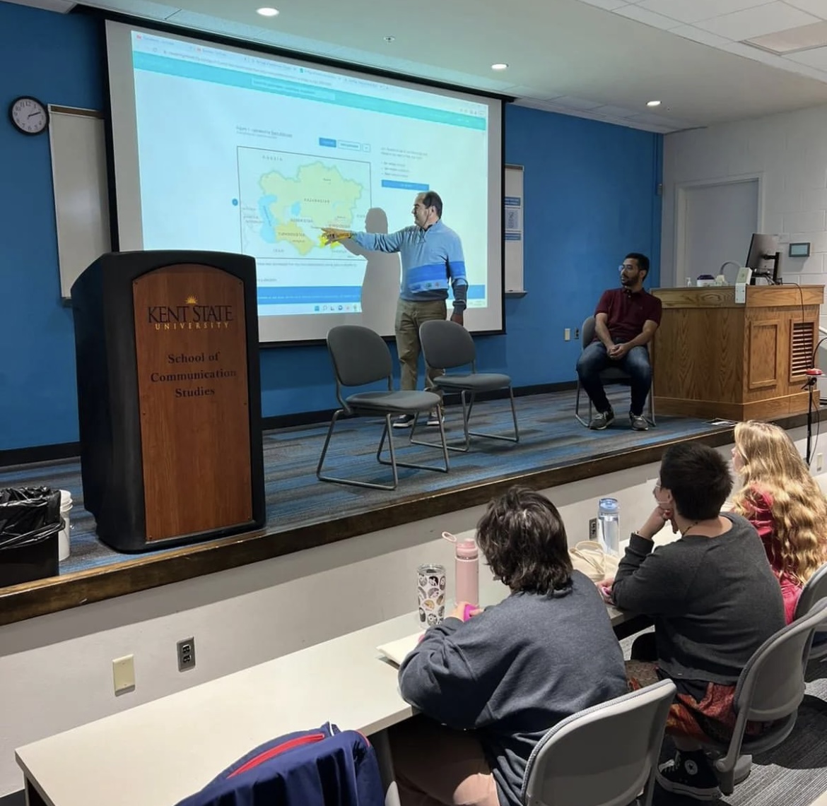 Aggarwal-Blackburn Visiting Scholar giving a presentation on a stage.