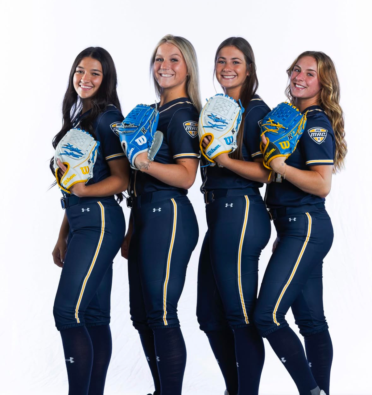 Abigael Pochie with friends on the softball team