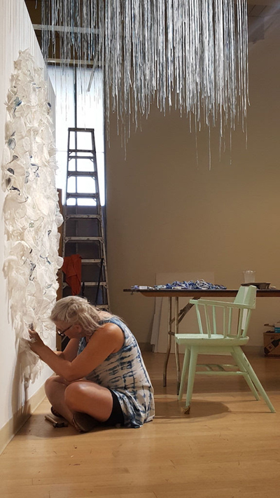 Alumna Rebecca Cross working on her installation at the CAN Triennial Alumna Rebecca Cross working on her installation at the CAN Triennial