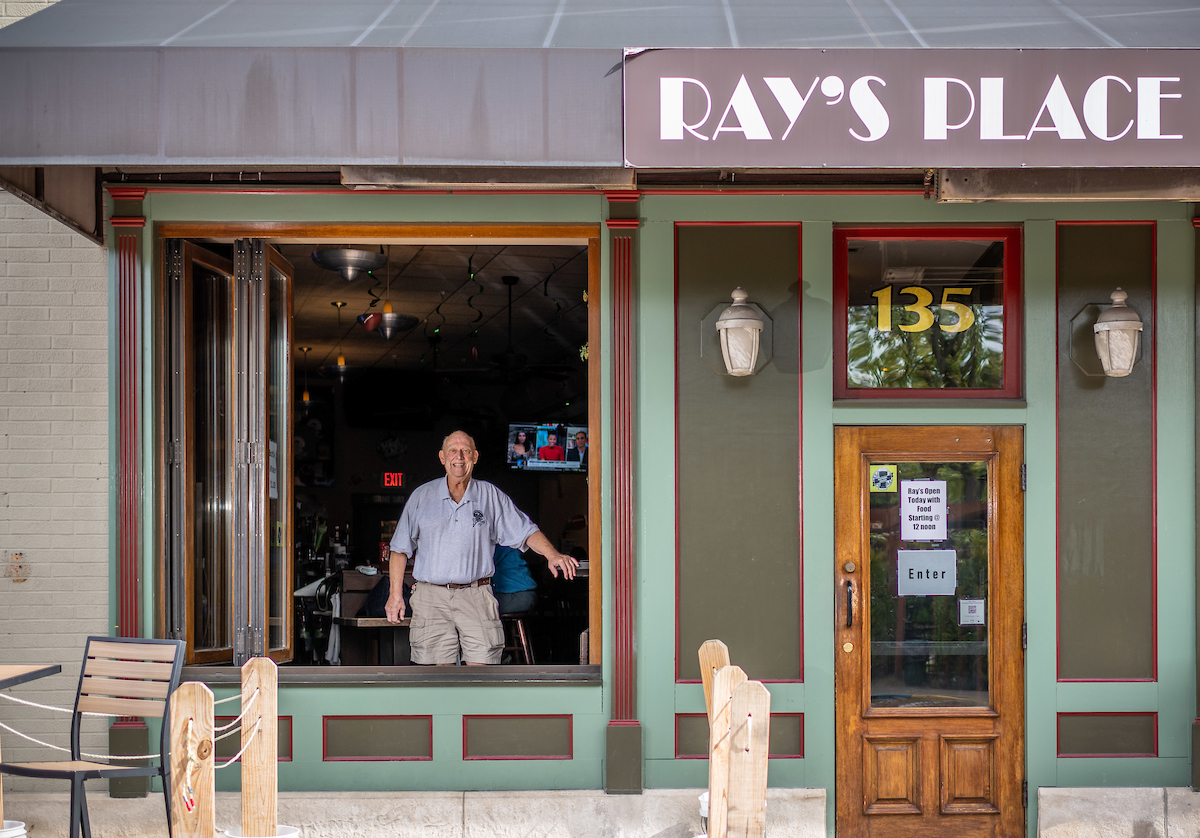 Charlie Thomas, owner of Ray's Place in downtown Kent, looks out the front window of his iconic tavern.