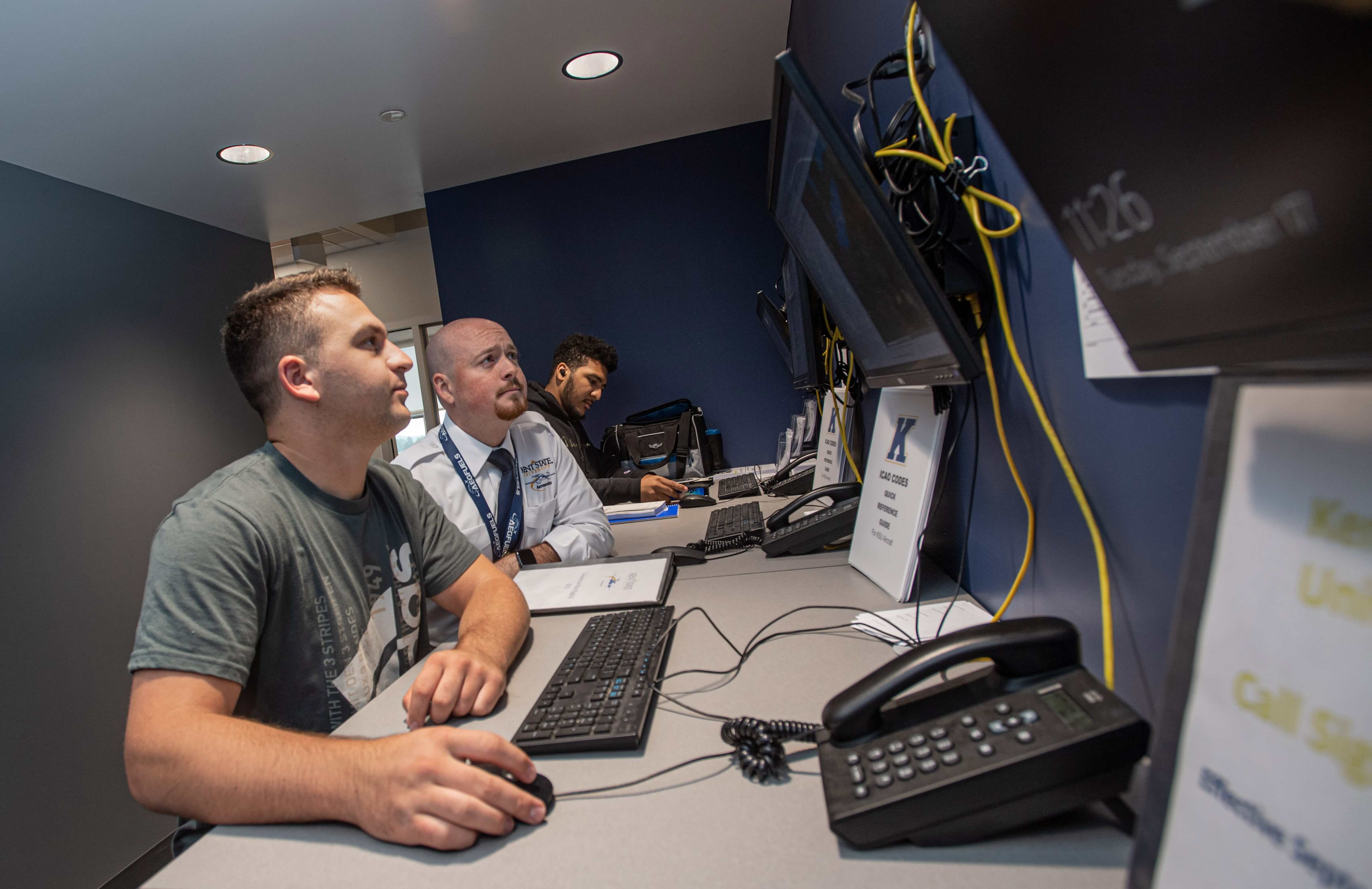 student and instructor monitoring flights