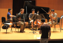 Pianist Spencer Myer instructs a student quartet during t he 2011 Kent/Blossom Music Festival.